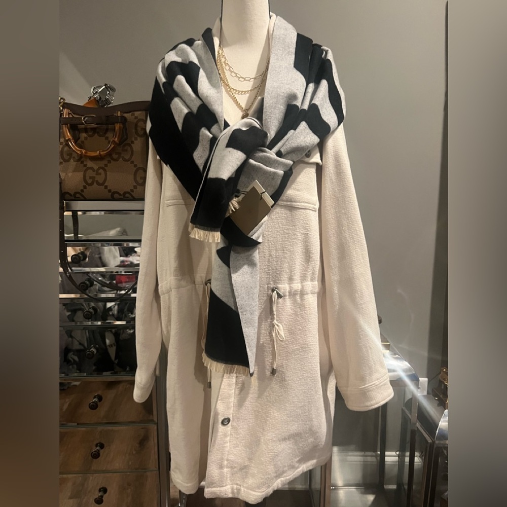 This new cream color is a shacket it is paired with a Burberry scarf.